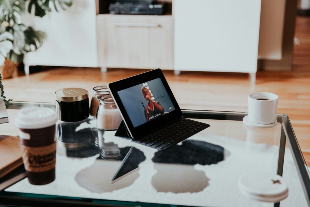 Freelancer workspace in 2025 with productivity tools on laptop and smartphone