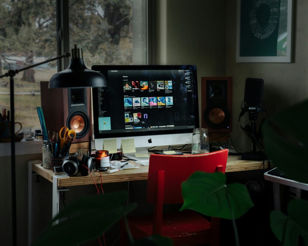 Remote job platforms 2025 – digital nomad working on laptop with global job icons.