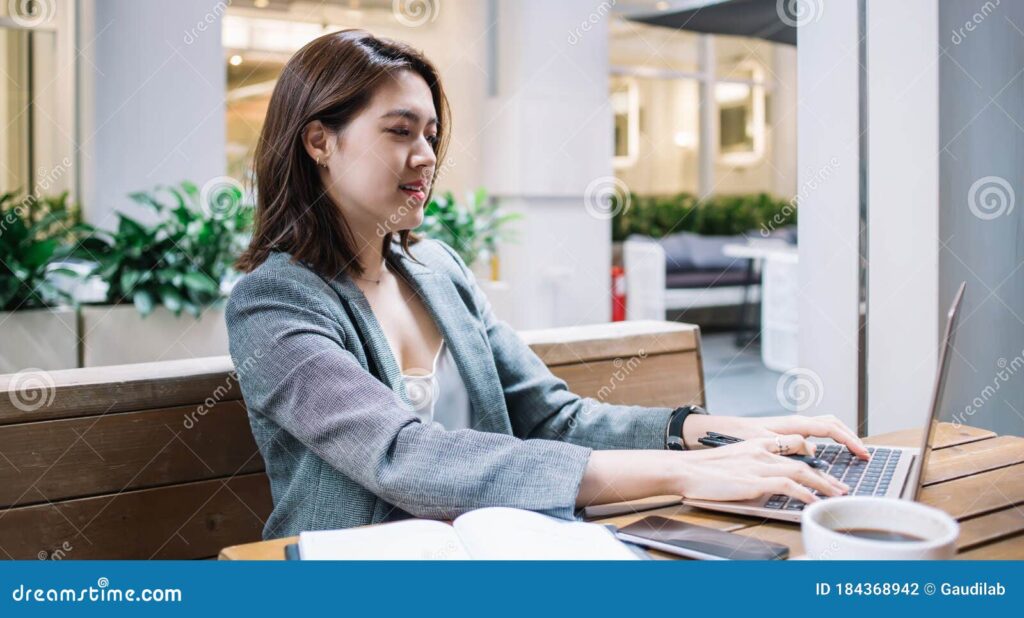 Freelancer using ChatGPT prompts for freelancers to write proposals for high-paying clients in a modern workspace.